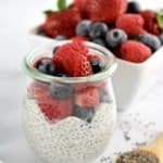 Chia Seed Pudding in glass jar with chopped berries on top
