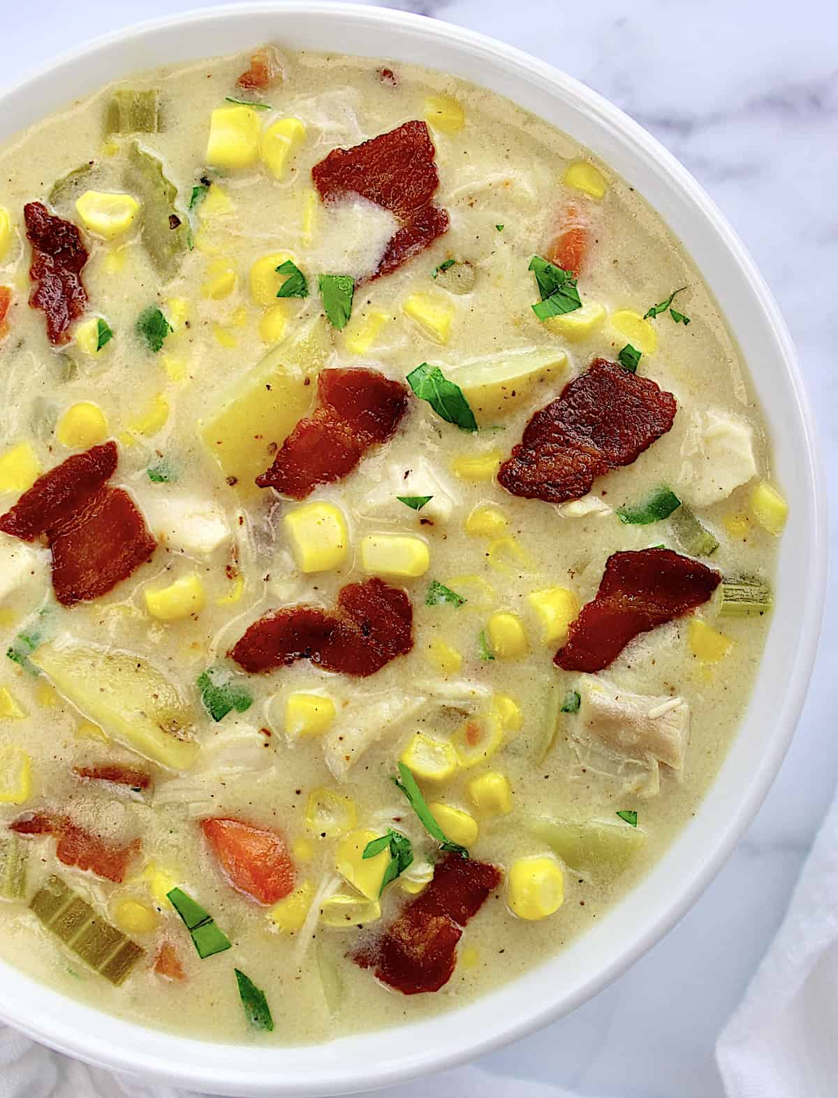 overhead view of Chicken Corn Chowder in white bowl
