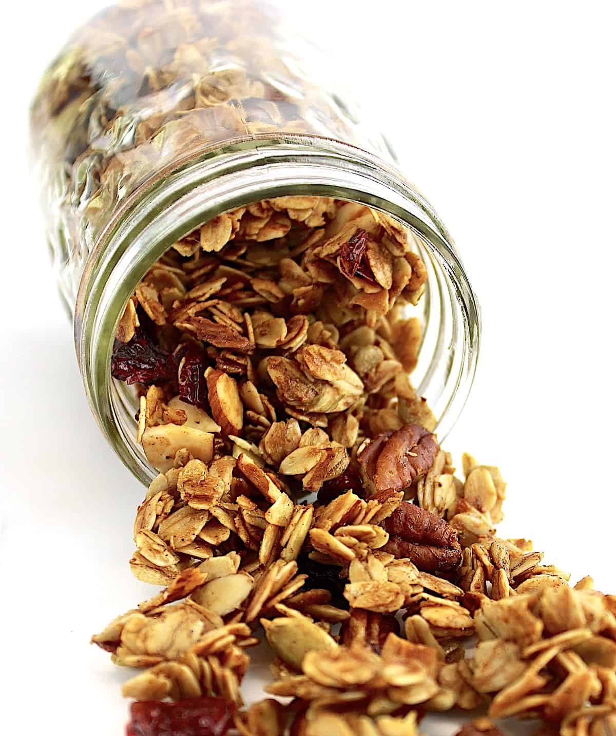 Homemade Granola spilling out of jar