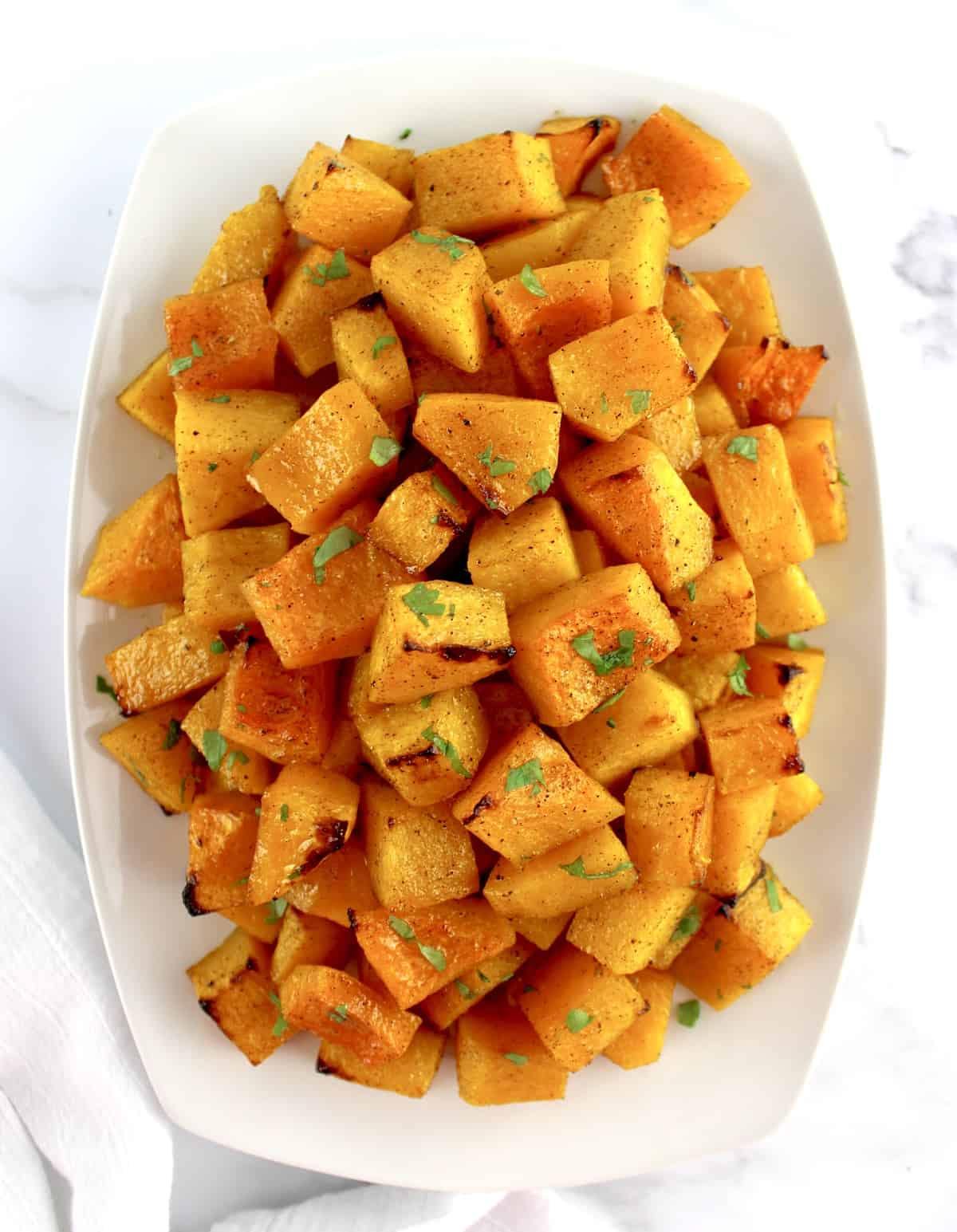 overhead view of Honey Roasted Butternut Squash in white dish