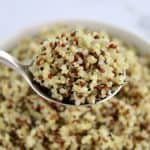 quinoa being held up with spoon