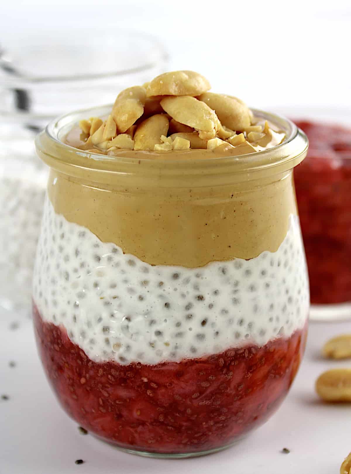 side view closeup of Peanut butter and Jelly Chia Pudding in glass jar