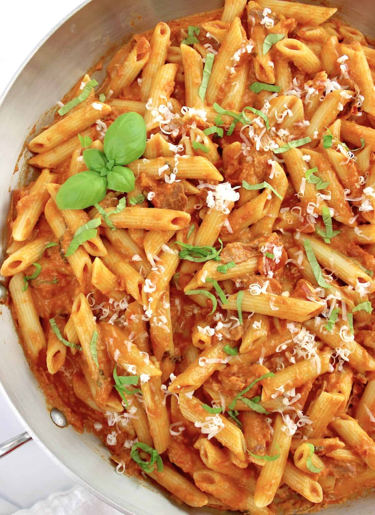 Penne Alla Vodka with basil and parmesan cheese on top