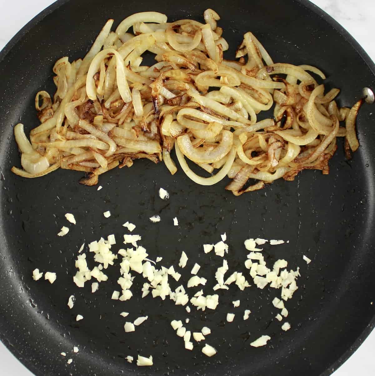caramelized onions with minced garlic in skillet