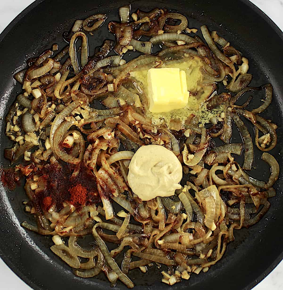 caramelized onions with butter and dijon in skillet