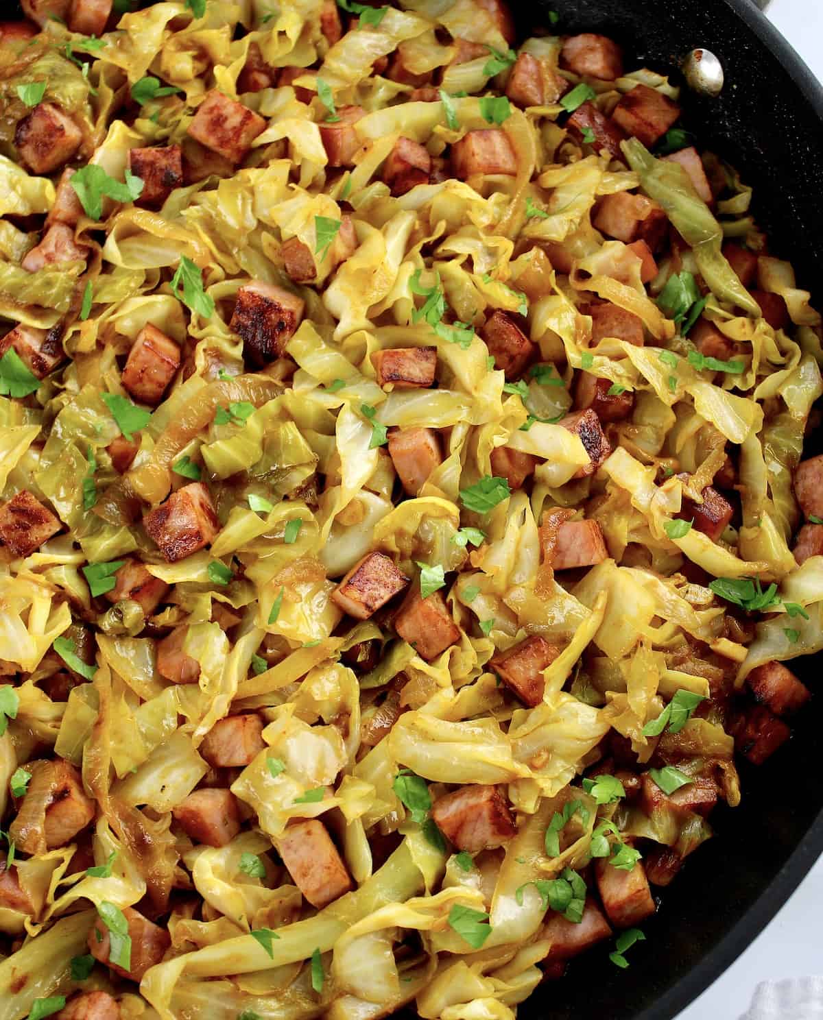 Fried Cabbage with Ham in skillet