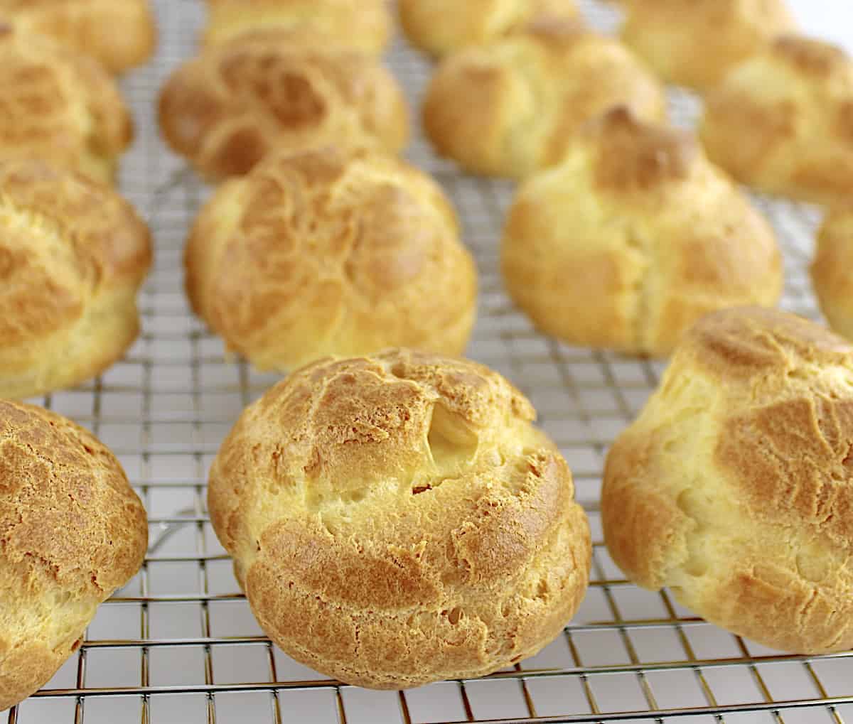 cream puffs cooling on wire rack