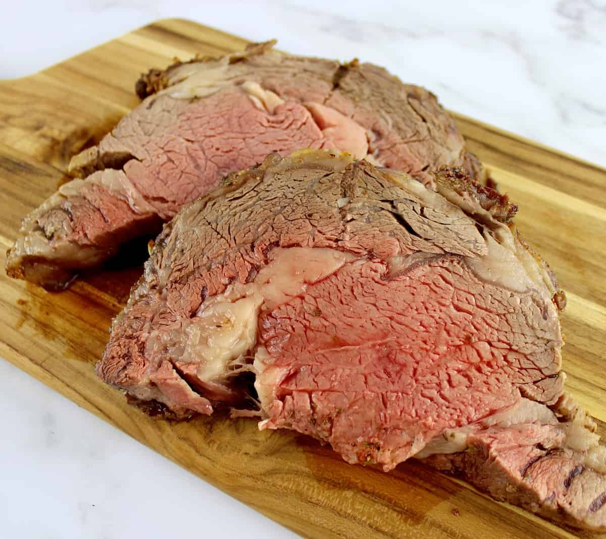 2 pieces of prime rib on cutting board