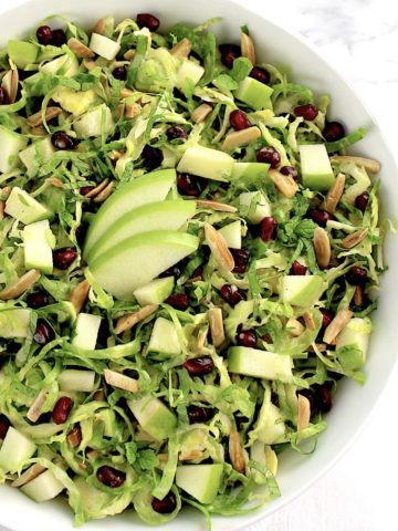 Shredded Brussels Sprouts Salad with 3 sliced green apples in center
