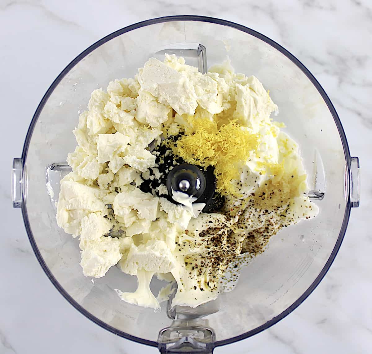 Whipped Feta Dip ingredients in food processor bowl unmixed