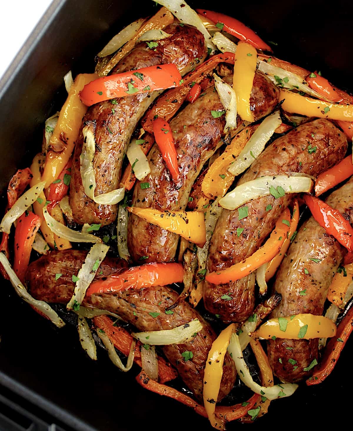 overhead view of Air Fryer Italian Sausage and Peppers in air fryer basket