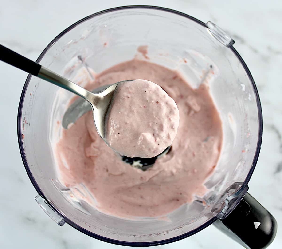 Easy Strawberry Mousse in spoon over food processor