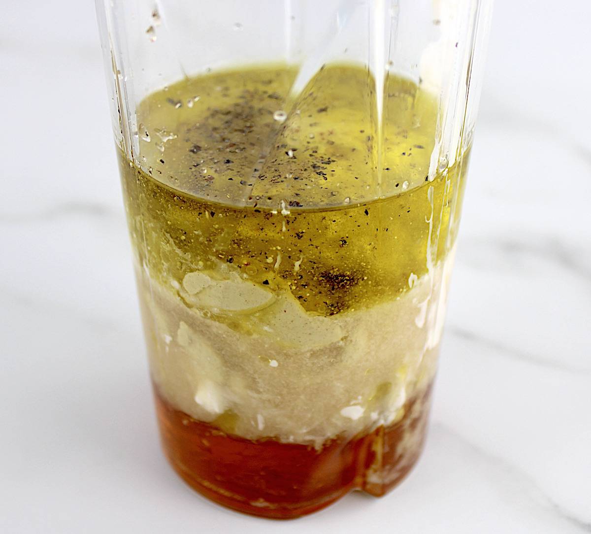 Honey Mustard Dressing ingredients in bullet blender cup unmixed