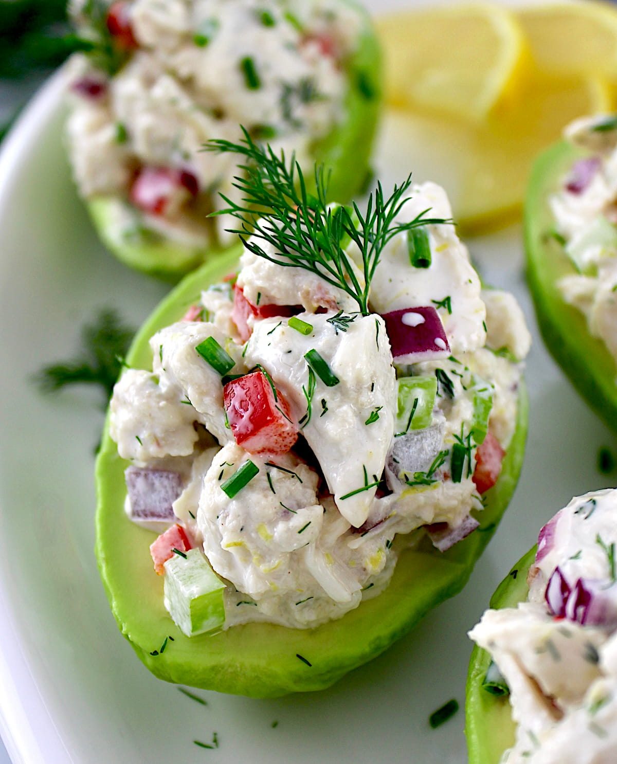 closeup of Crab Salad Stuffed Avocado on white plate