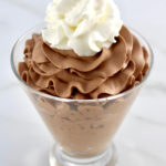 Easy Chocolate Mousse in glass with whip cream on top