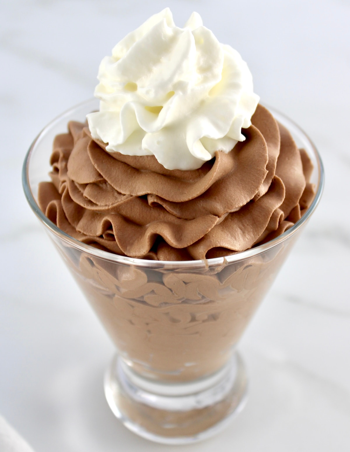 Easy Chocolate Mousse in glass with whip cream on top