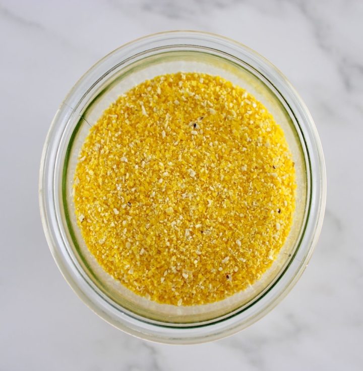 overhead view of ground polenta in glass bowl