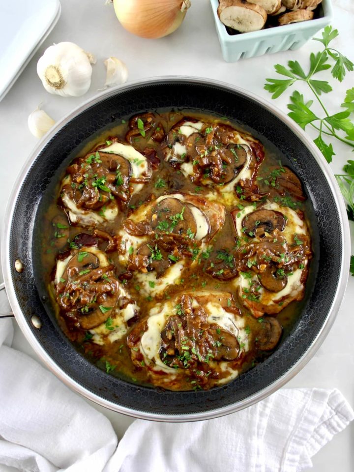 overhead view of French Onion Smothered Pork Chops in skillet