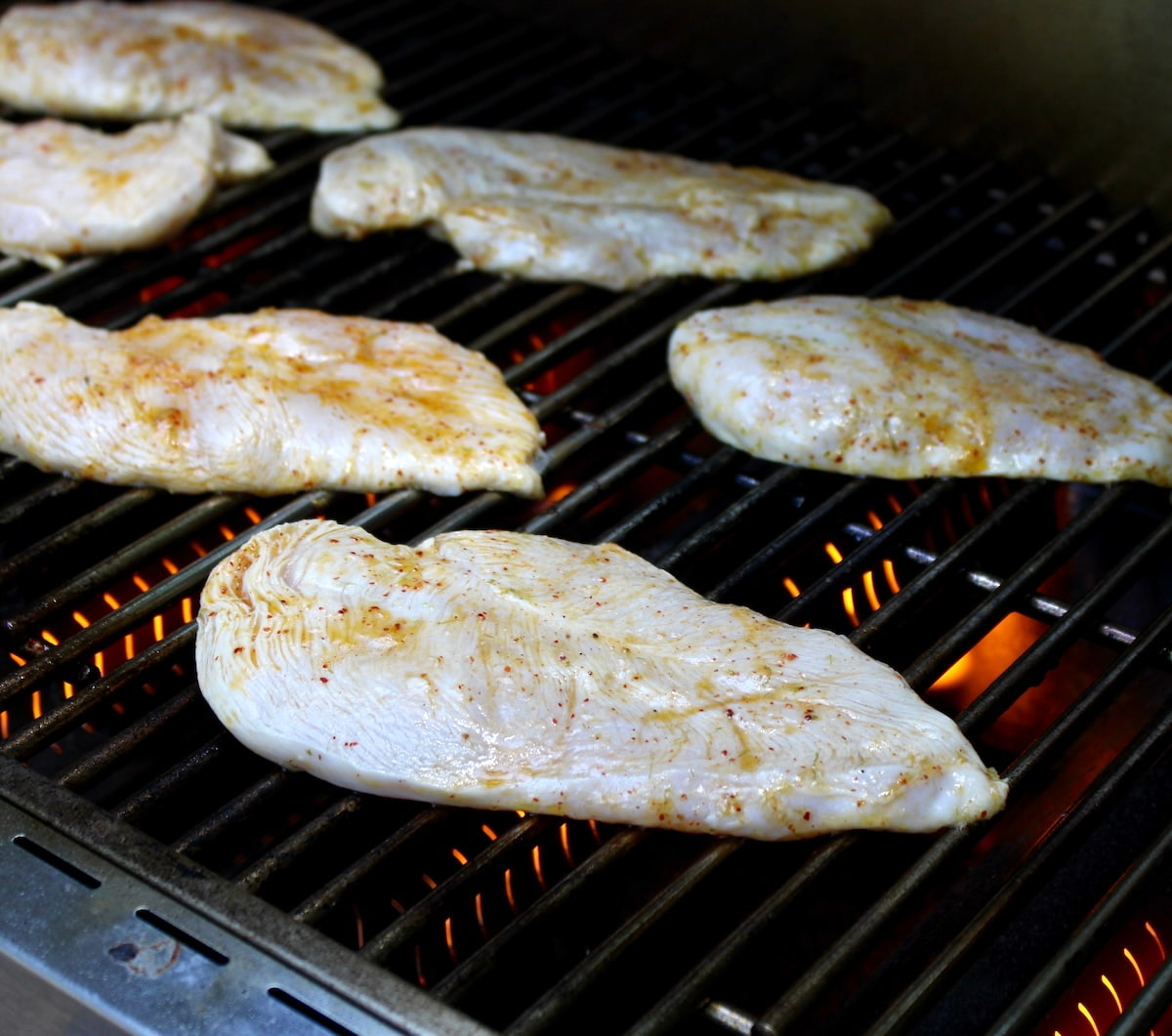 raw chicken tajin cooking on grill