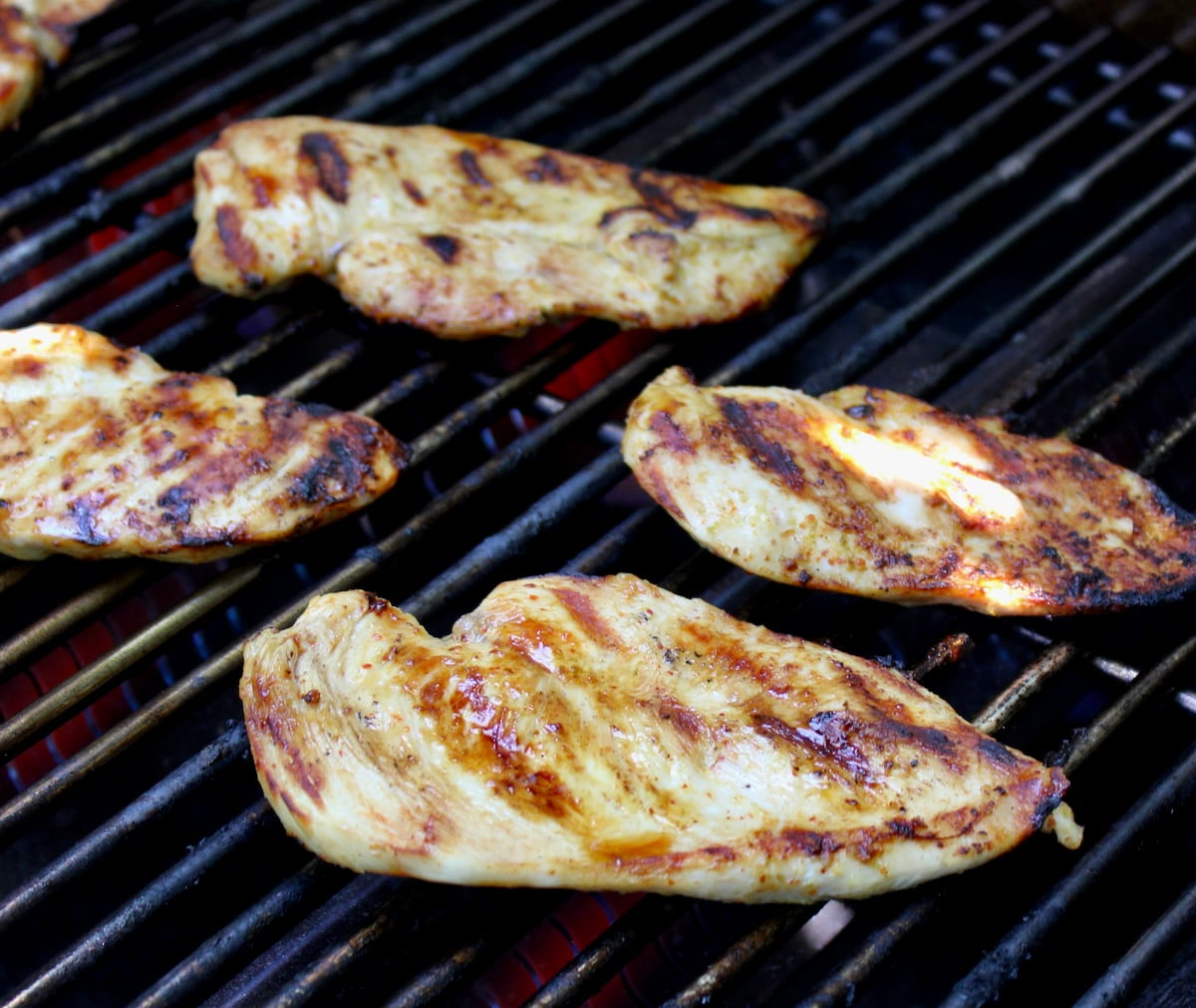 Tajin Chicken cooking on grill