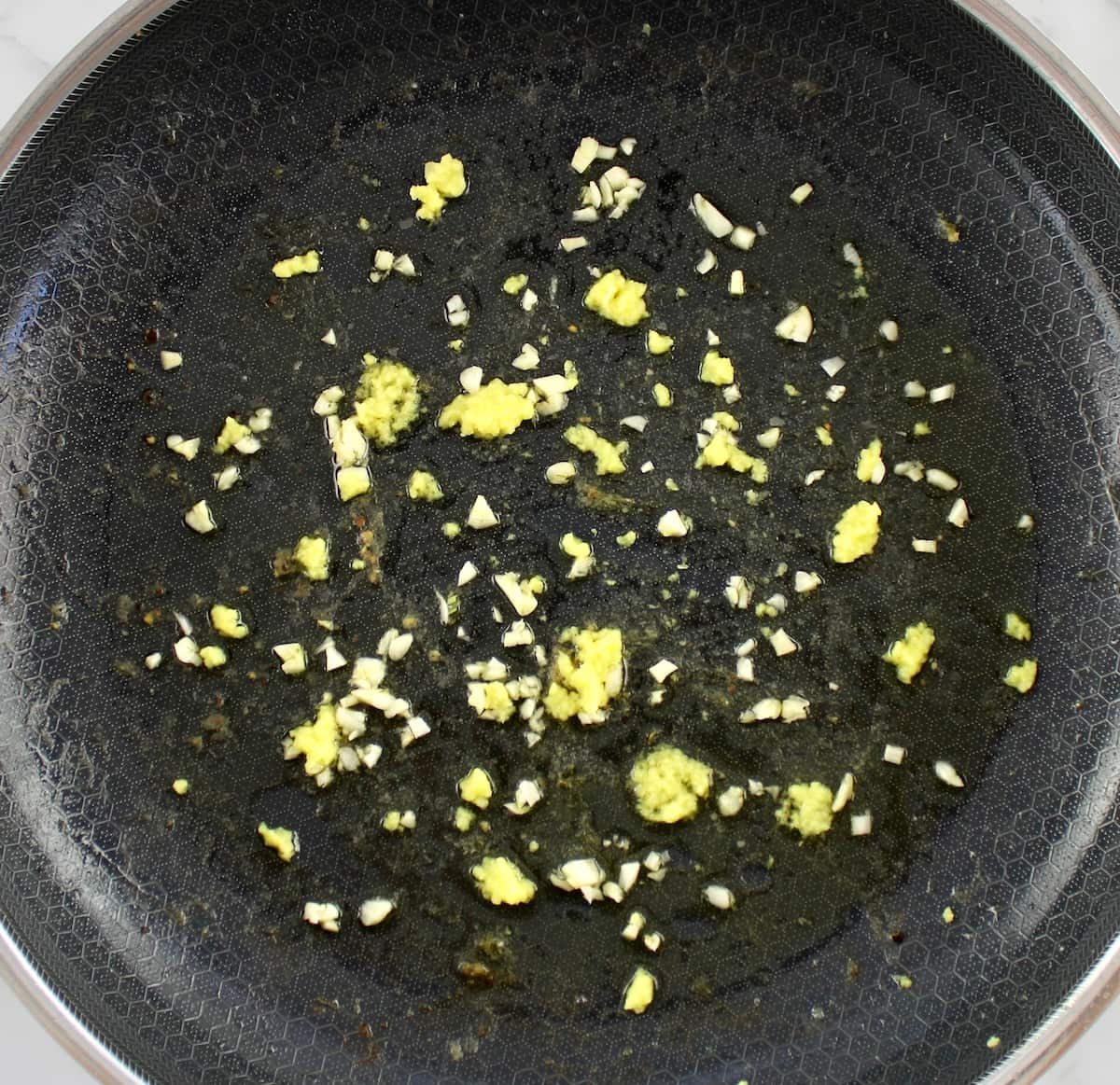minced garlic and ginger in skillet