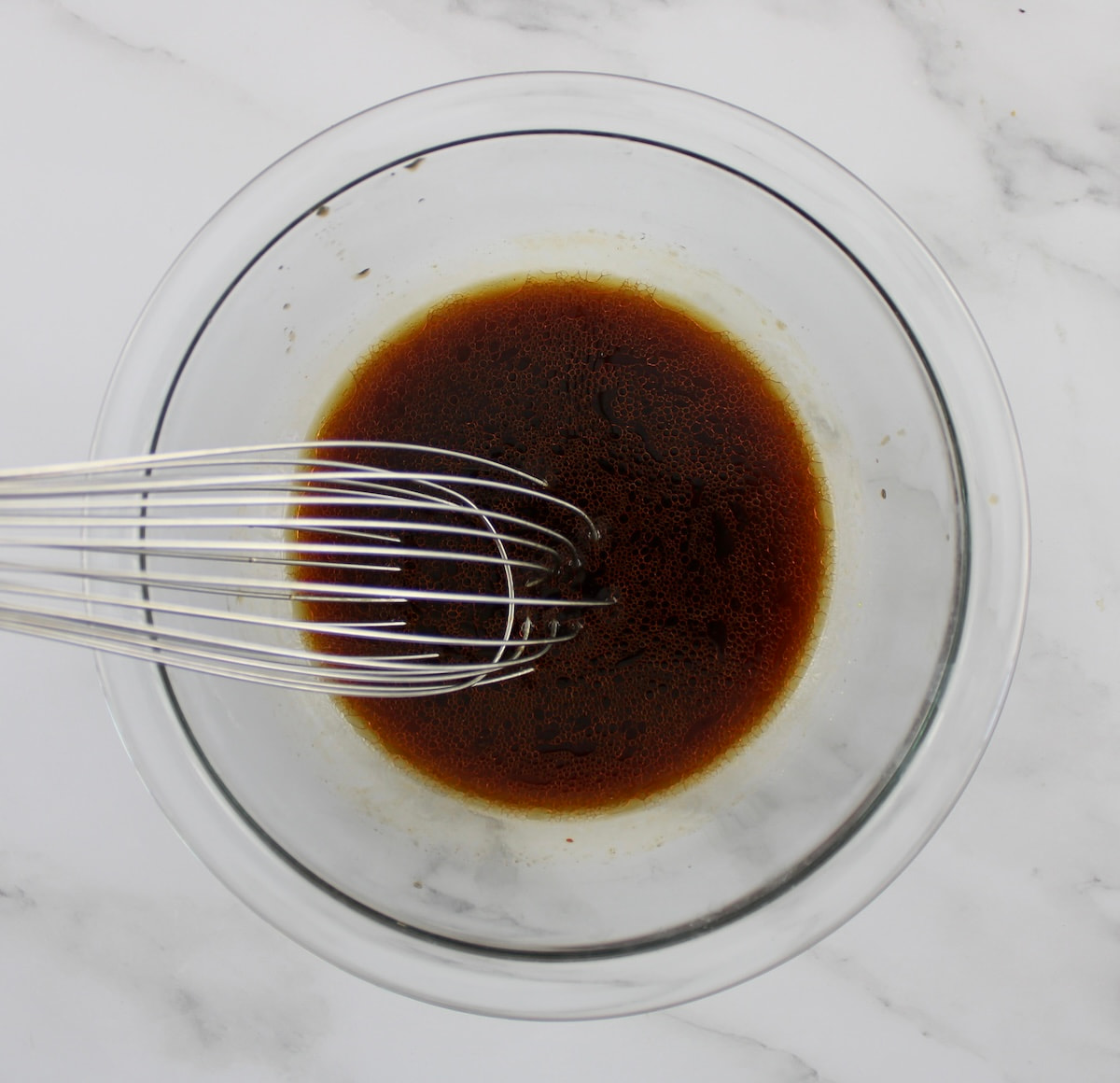 Shrimp Egg Roll in a Bowl sauce in glass bowl with whisk