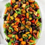 overhead view of Roasted Vegetable Salad on white oval platter