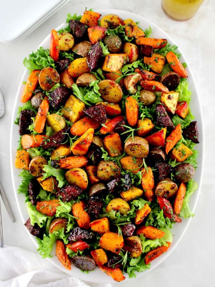 overhead view of Roasted Vegetable Salad on white oval platter