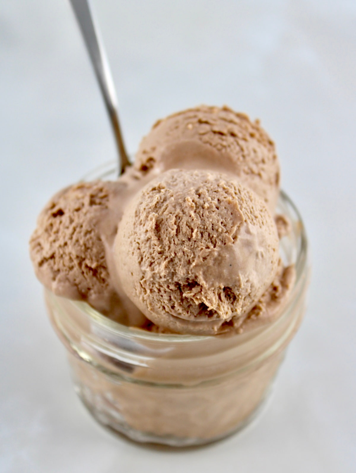 Mason Jar Chocolate Ice Cream in open jar with spoon sticking out