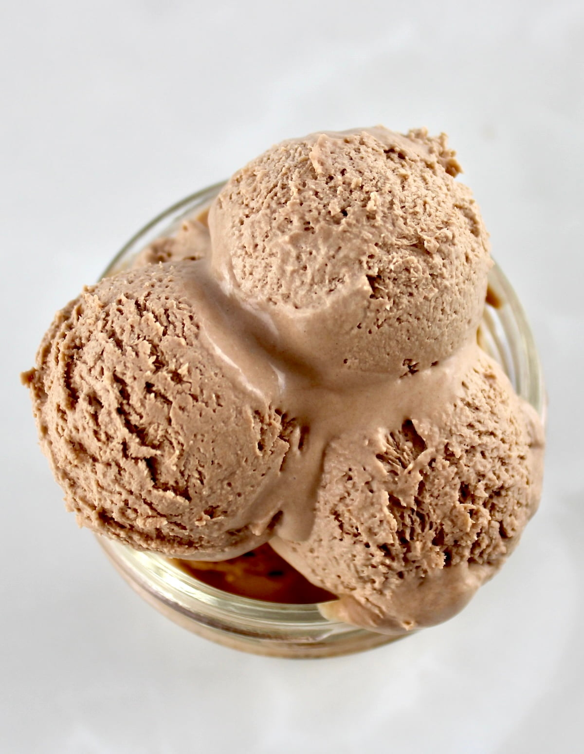 overhead view of 3 scoops of Mason Jar Chocolate Ice Cream in open jar