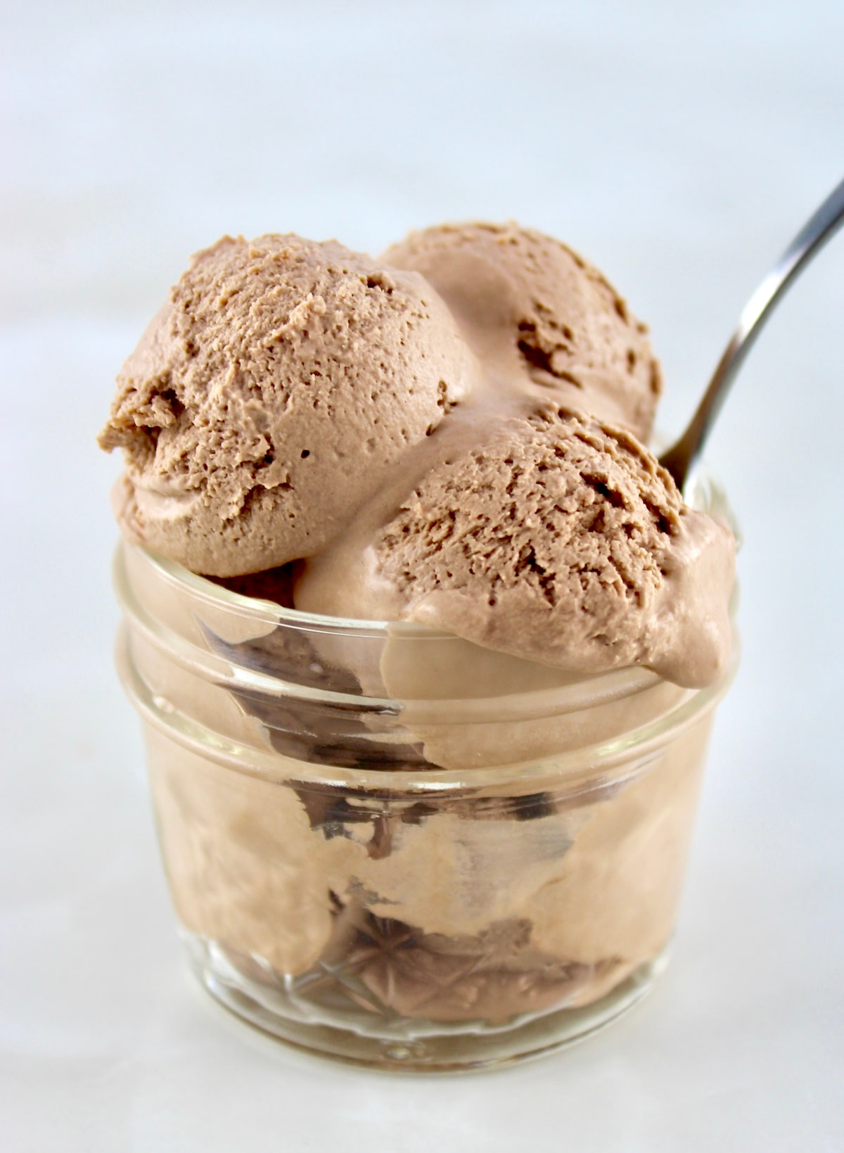 Mason Jar Chocolate Ice Cream in open jar with spoon sticking out