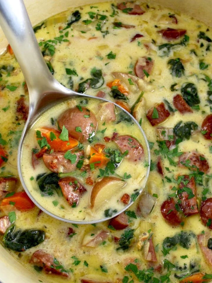 Kielbasa Potato Soup in pot with ladle full