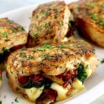 Stuffed Pork Chops on white plate