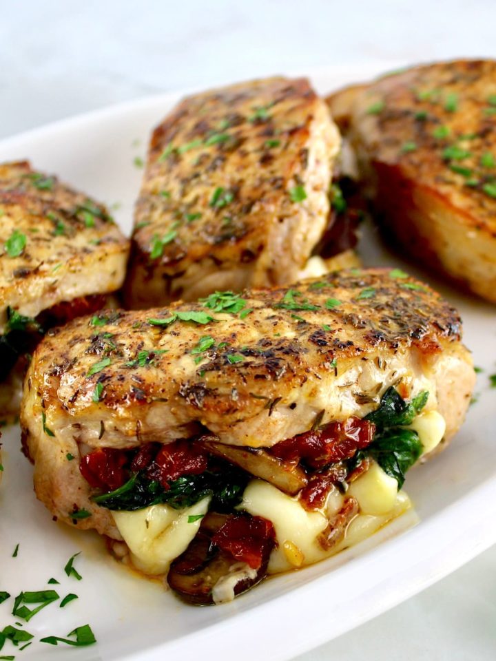 Stuffed Pork Chops on white plate