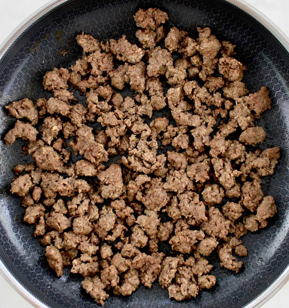 browned ground beef in skillet
