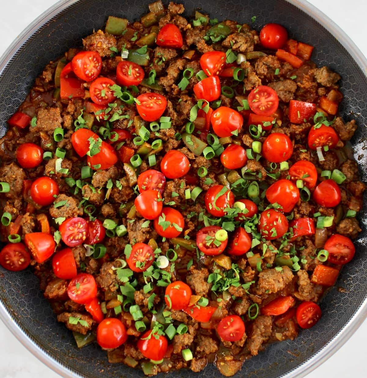 Taco Skillet with halved cherry tomatoes on top