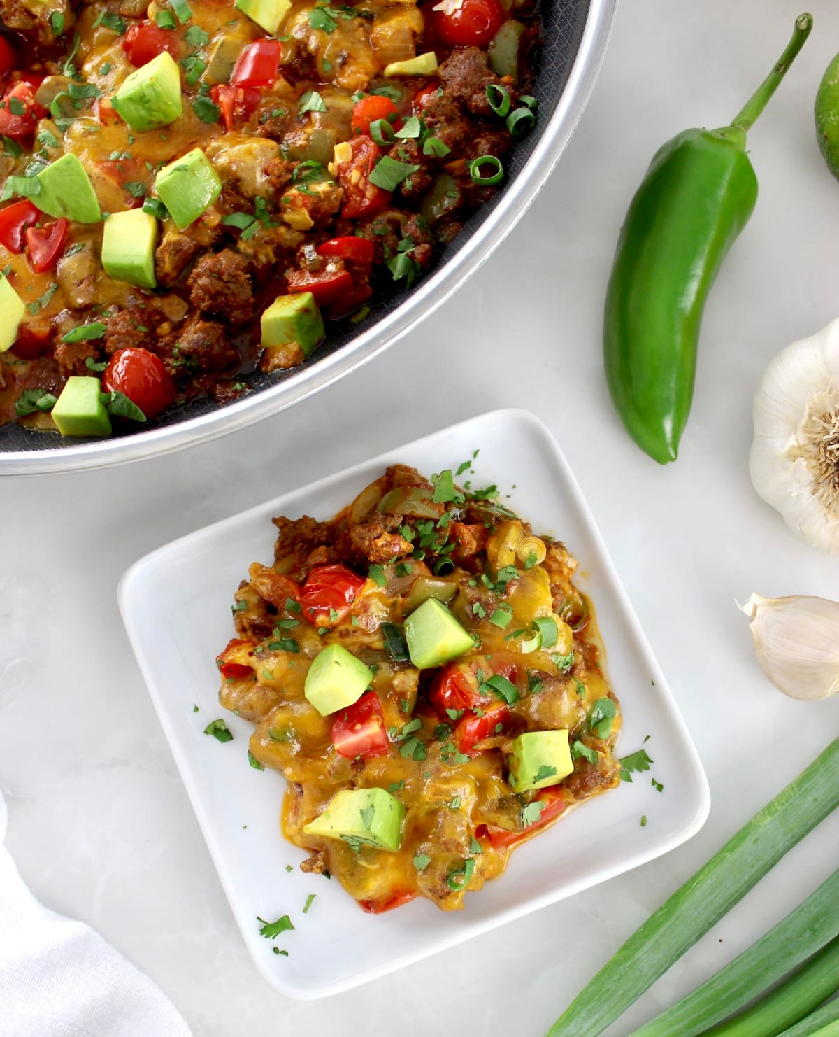 overhead view of Taco Skillet on white plate with skillet in back