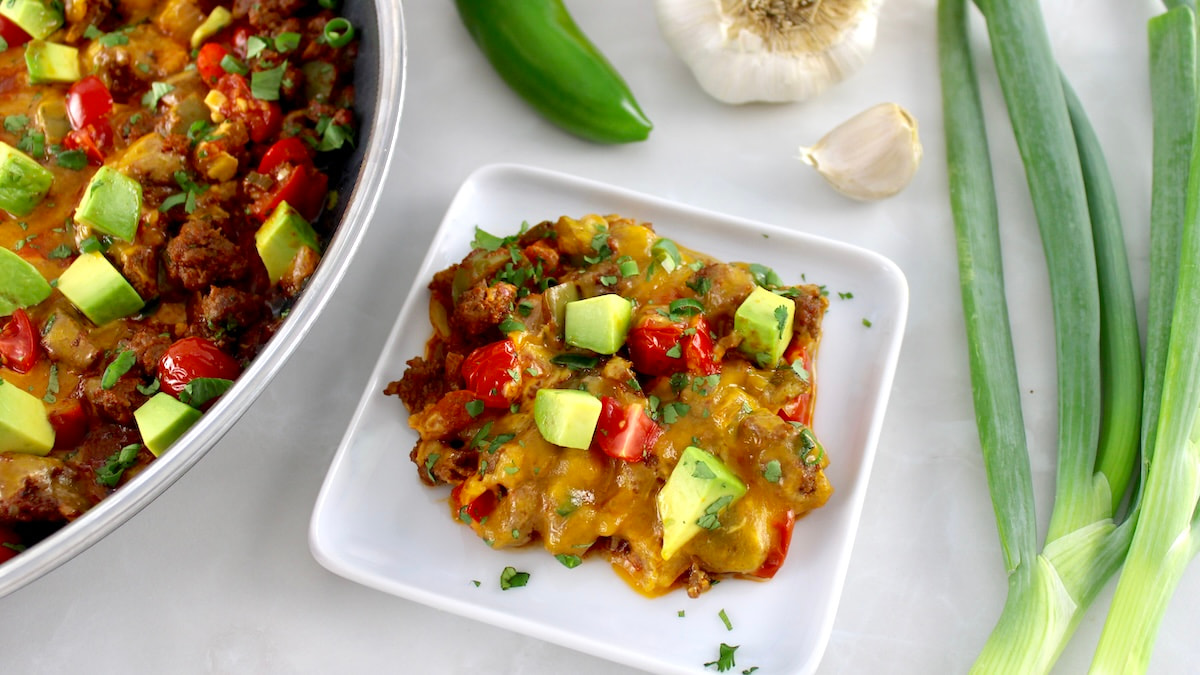 overhead view of Taco Skillet on white plate with skillet in back
