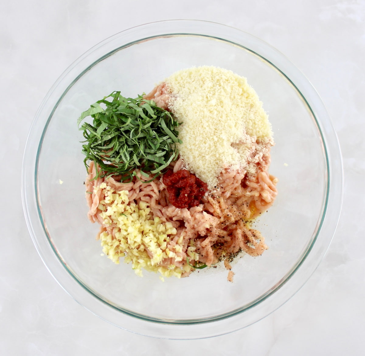 Chicken Parmesan Meatballs ingredients in glass bowl unmixed