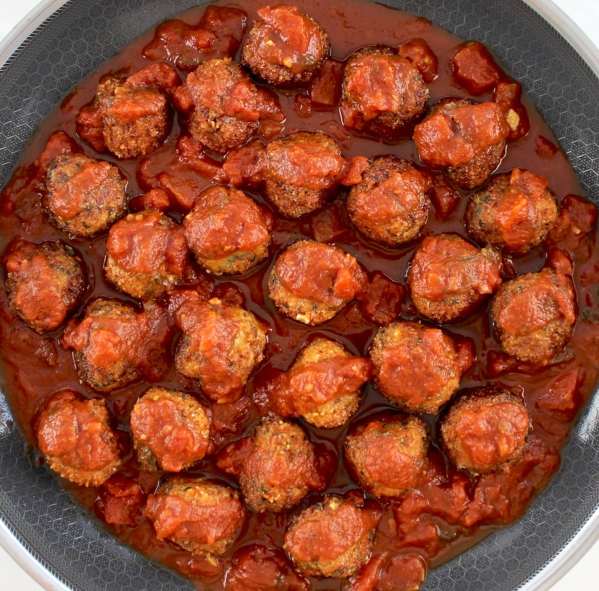Chicken Parmesan Meatballs in marinara sauce in skillet