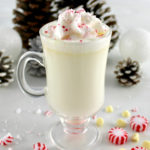 Peppermint White Hot Chocolate in glass with whip cream and crushed peppermint on top
