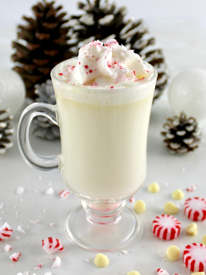Peppermint White Hot Chocolate in glass with whip cream and crushed peppermint on top