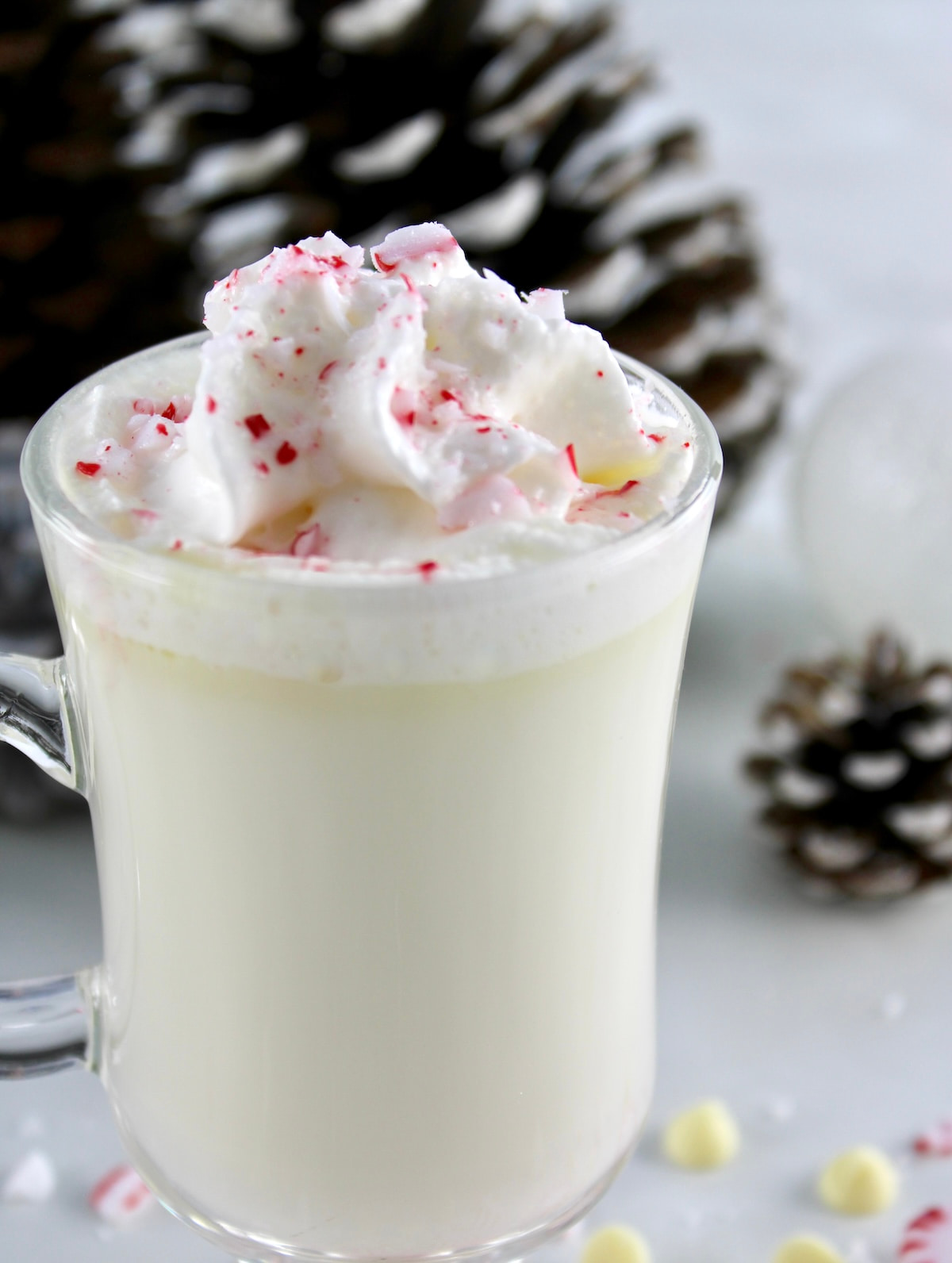 overhead view of Peppermint White Hot Chocolate with whip cream and crushed peppermints on top