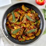 overhead view of 4 Pork Chops with Apples in skillet