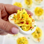 holding up Classic Deviled Egg