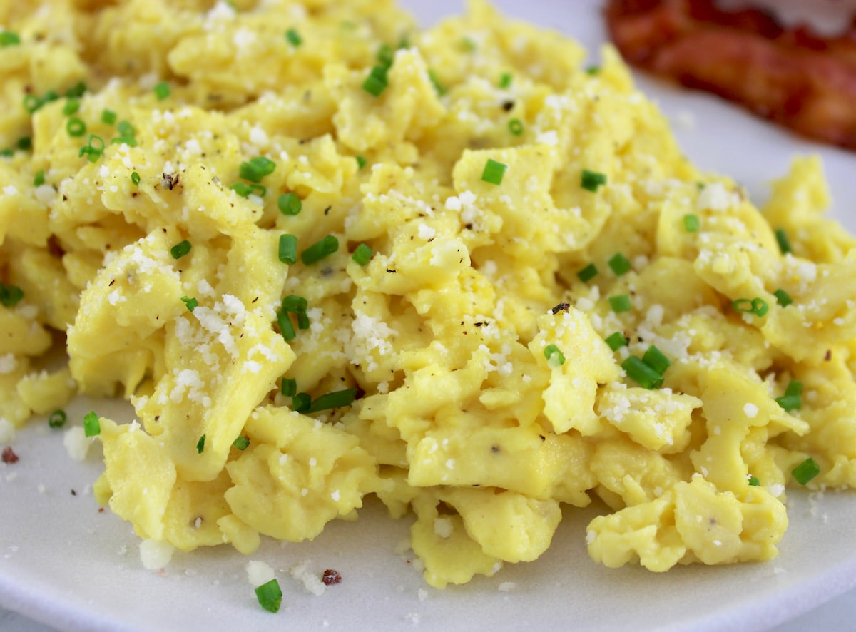 closeup of Ricotta Scrambled Eggs on white plate