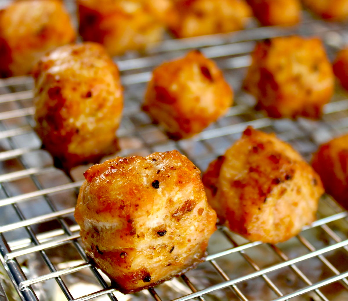 closeup of Cajun Salmon Bites on baking rack