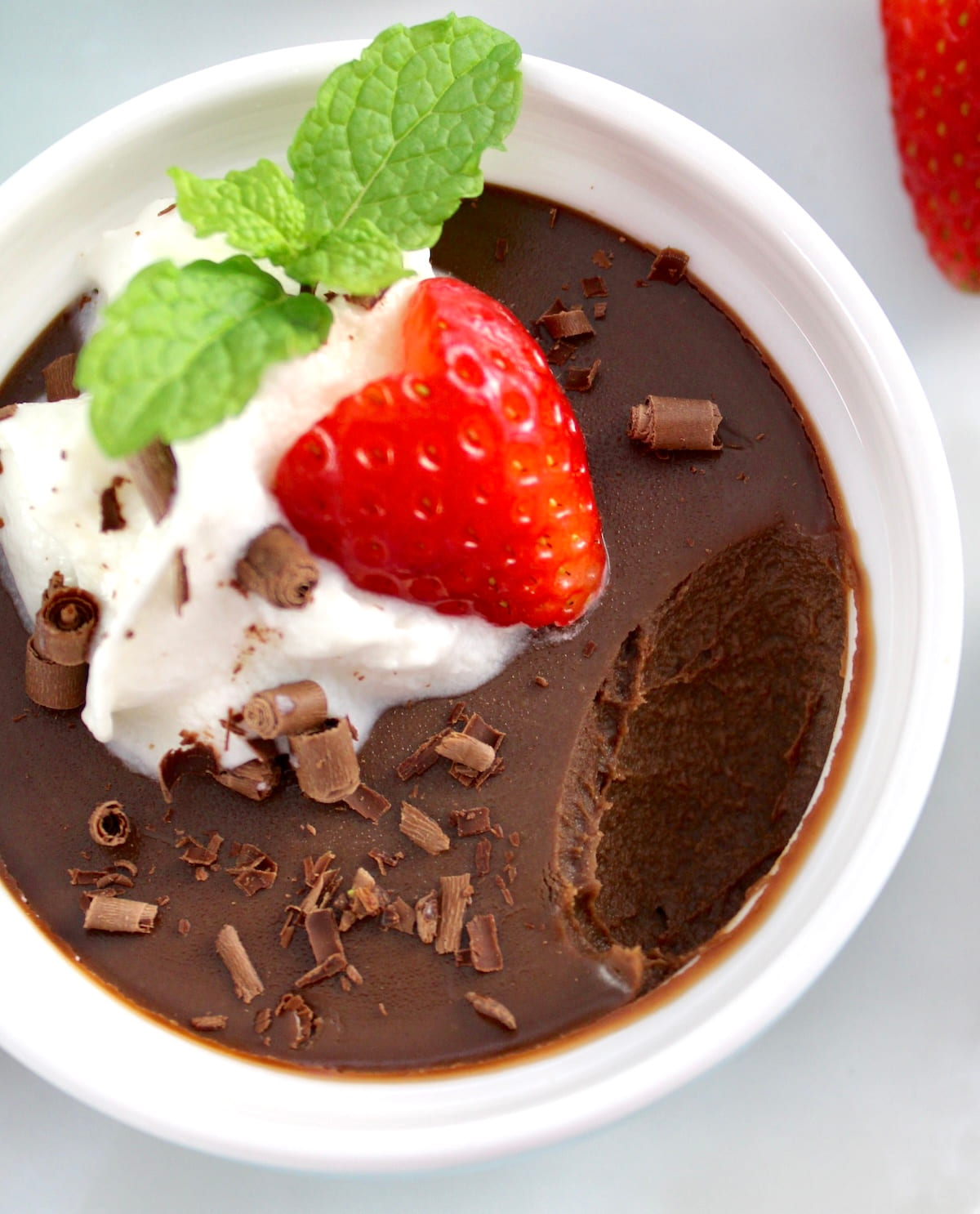 closeup of Chocolate Pots de Crème with bite missing