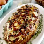 French Onion Meatloaf on white platter with fresh time around