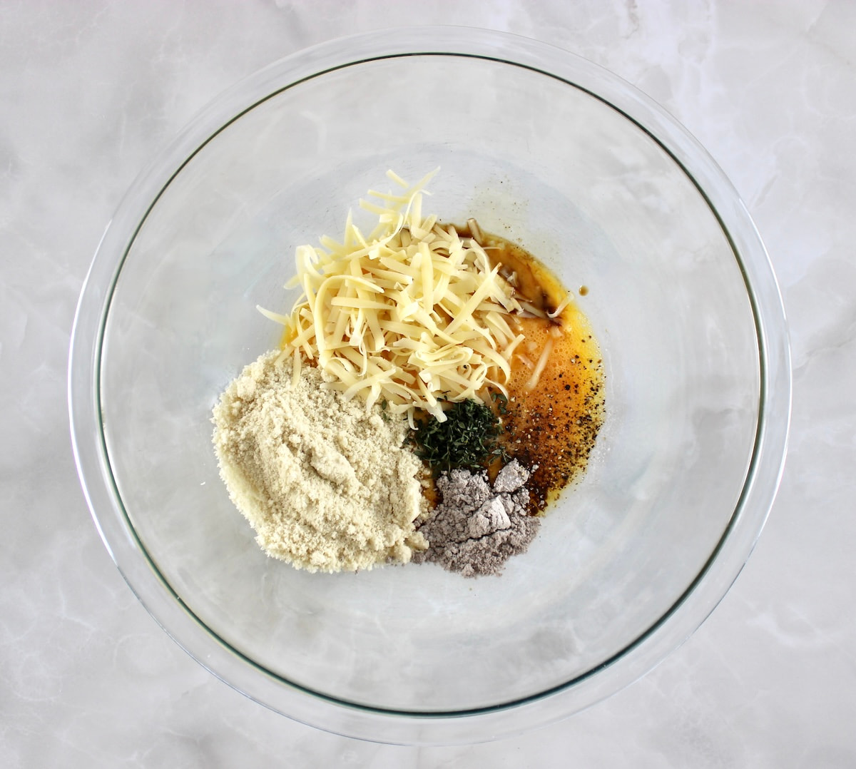 French Onion Meatloaf ingredients in glass bowl unmixed